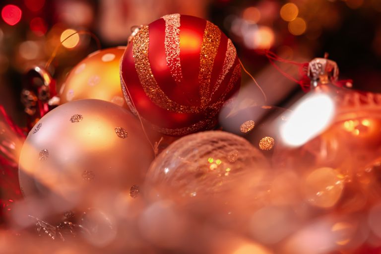 Close-up of colorful Christmas ornaments creating a festive and warm holiday ambiance.